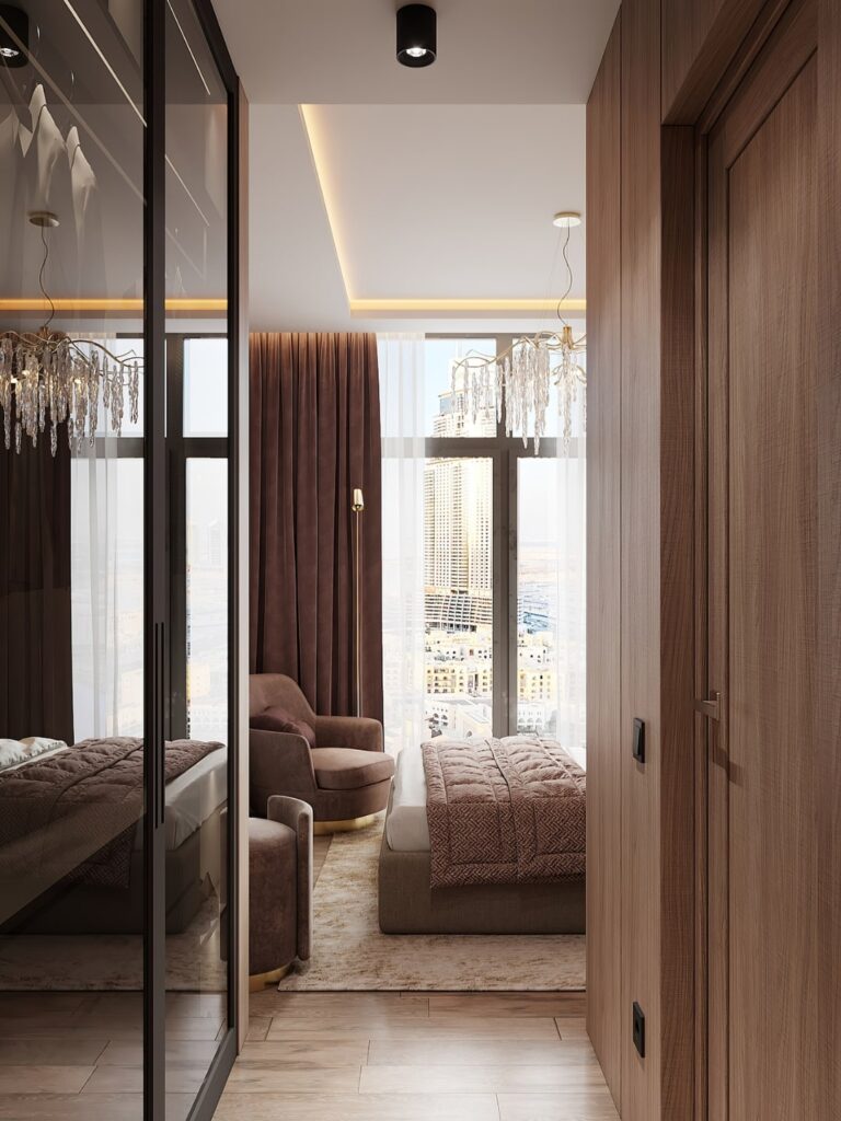 Intrarea intr-un dormitor amenajat in stil modern. Putem vedea patul si o parte din mobilierul ales pentru designul interior al camerei.